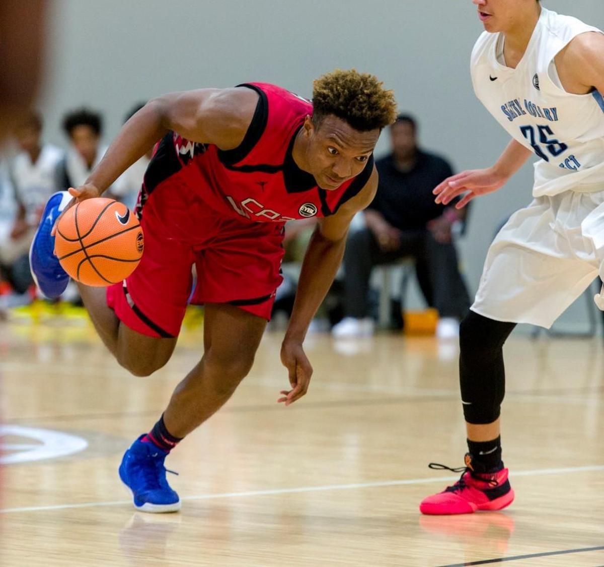 Wendell Carter, Jr., left, moves to the basket during the Nike Elite Youth Basketball League recruiting showcase in 2016.
