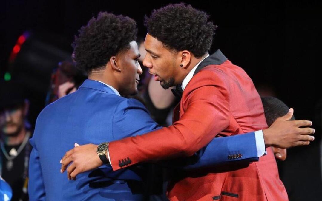 Former Duke teammates Justise Winslow, left, and Jahlil Okafor embrace after Okafor was selected third overall by the Philadelphia 76ers in the first round of the 2015 NBA draft at the Barclays Center in Brooklyn, N.Y.