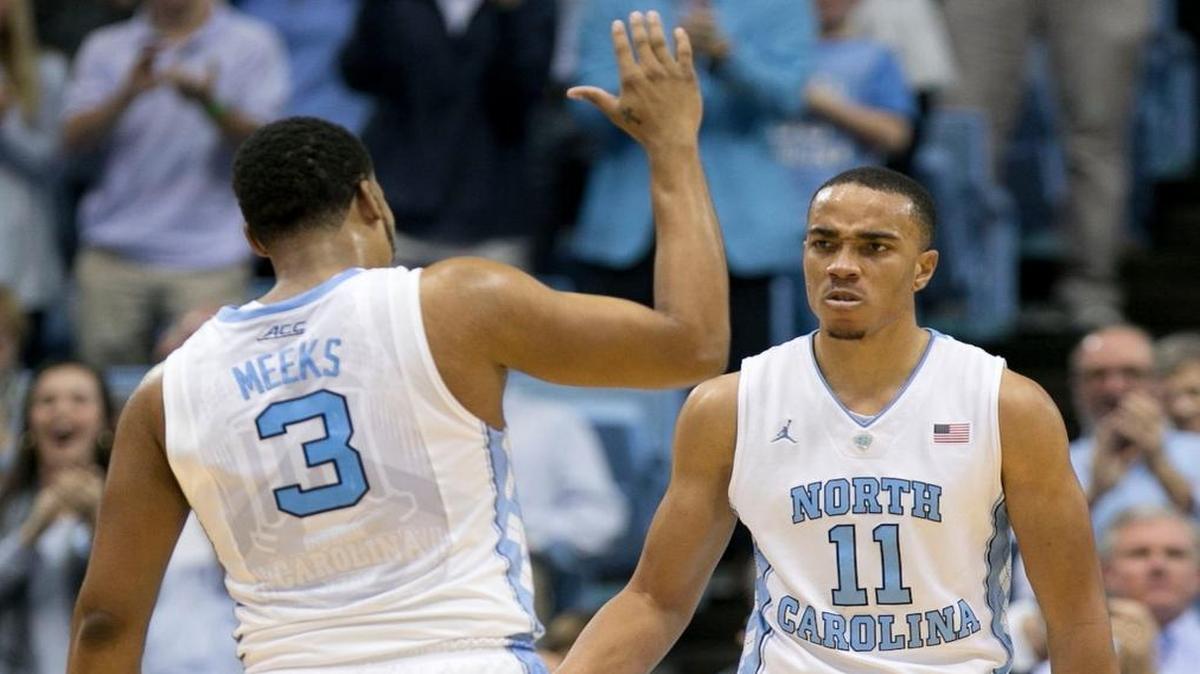 North Carolinas Brice Johnson (11) and reacts after scoring and drawing a foul to tie N.C. State in the first half at the Smith Center.