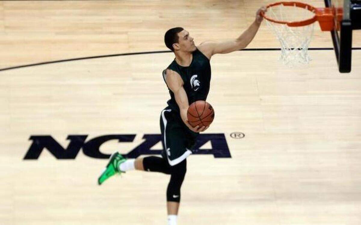 
Michigan State's Gavin Schilling goes up to dunk during practice for an NCAA college basketball tournament second round game in Charlotte, N.C., Thursday, March 19, 2015. Michigan State plays Georgia on Friday.

