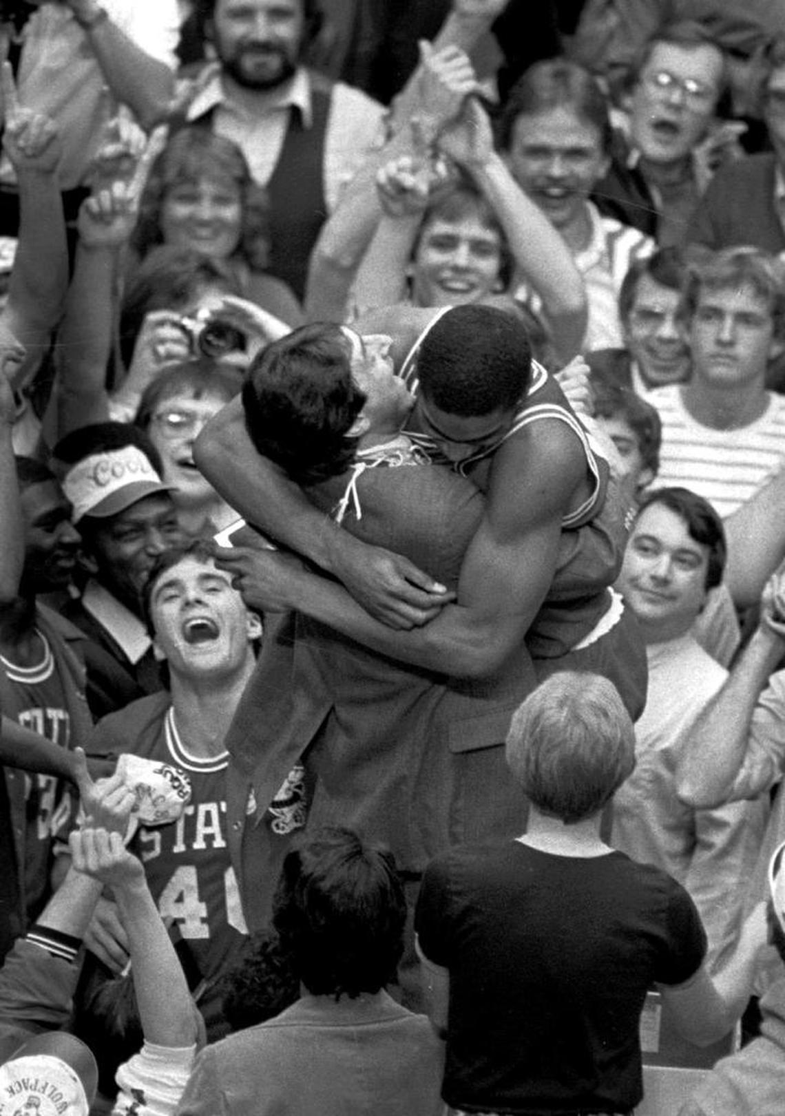 N.C. State coach Jim Valvano embraces sophomore forward Lorenzo Charles moments after Charles had dunked a shot to give N.C. State the win over Houston on April 5, 1983 in the NCAA final at Albuquerque.