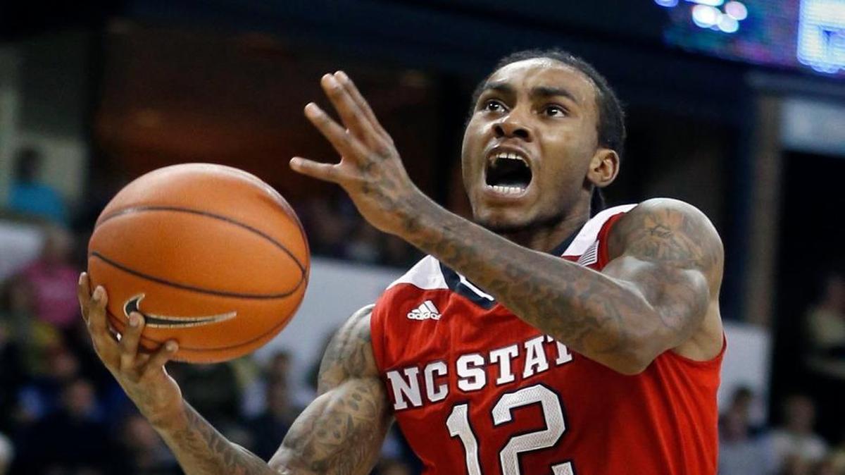N.C. State's Cat Barber (12) drives to the basket past Wake Forest's Codi Miller-McIntyre (0) during the Wolfpack's game against Wake Forest at Lawrence Joel Coliseum in Winston-Salem, N.C., Sunday, January 10, 2016.