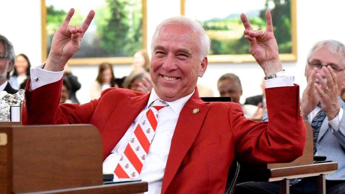 N.C. Sen. John Alexander flashes the Wolfpack sign at Roy Williams on May 3, 2017, during a joint session of the N.C. House and Senate that honored the Tar Heels and their 2017 NCAA national basketball championship.