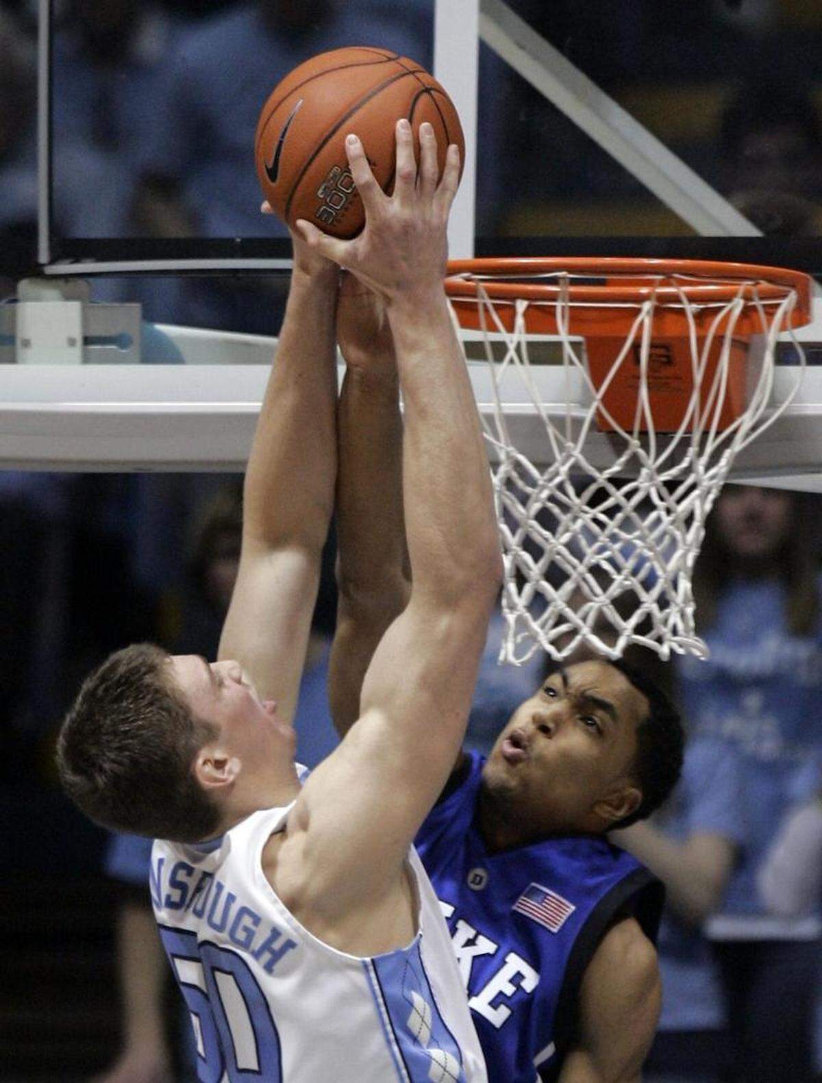 UNC’s Tyler Hansbrough scores past Duke’s Gerald Henderson on March 4, 2007.