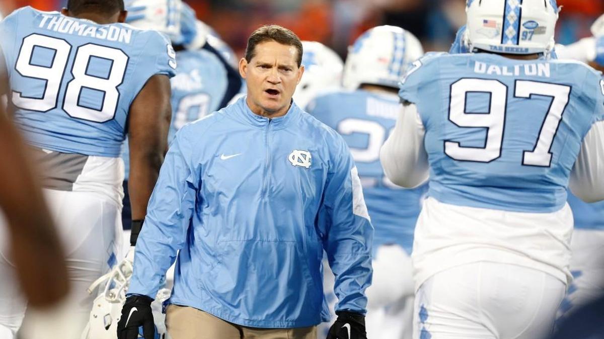 UNC’s defensive coordinator Gene Chizik watches his team warm up before its ACC championship game against Clemson on Dec. 5. Chizik, who plans to stay at UNC, has turned the Tar Heels’ defense around.