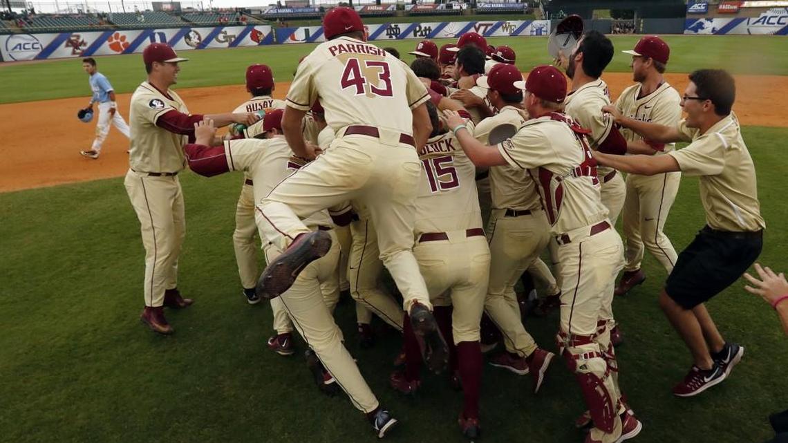 Florida State players celebrate after defeating North Carolina in the Atlantic Coast Conference baseball tournament championship game in Louisville, Ky., Sunday.