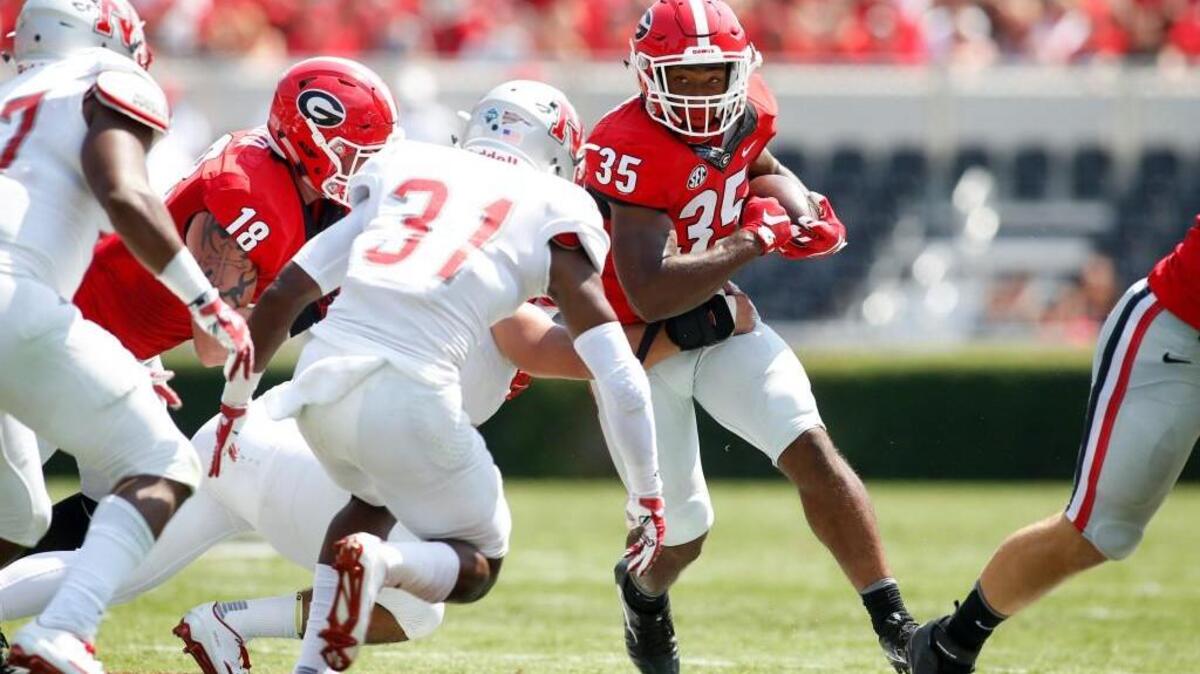 Georgia running back Brian Herrien, middle, runs against FCS opponent Nicholls on Sept. 10. The Bulldogs won a close game 26-24. North Carolina faces another FCS team, James Madison, on Saturday.