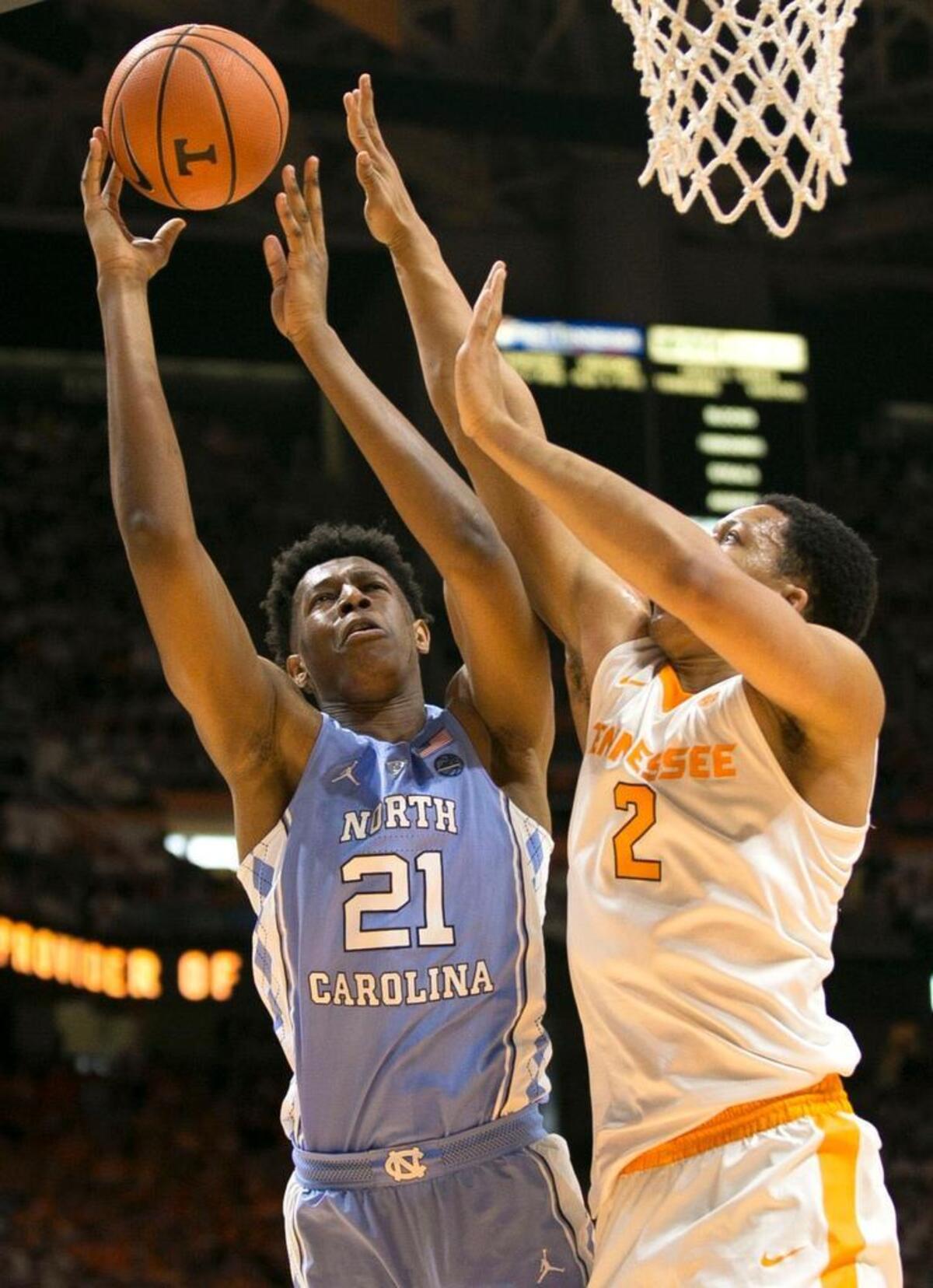 North Carolina’s Sterling Manley (21) puts up a shot over Tennessee’s Grant Williams (2) during the second half on Sunday, December 17, 2017 at Thompson-Boling Arena in Knoxville, Tenn. Manley scored 10 points in the Tar Heels’ 78-73 victory.