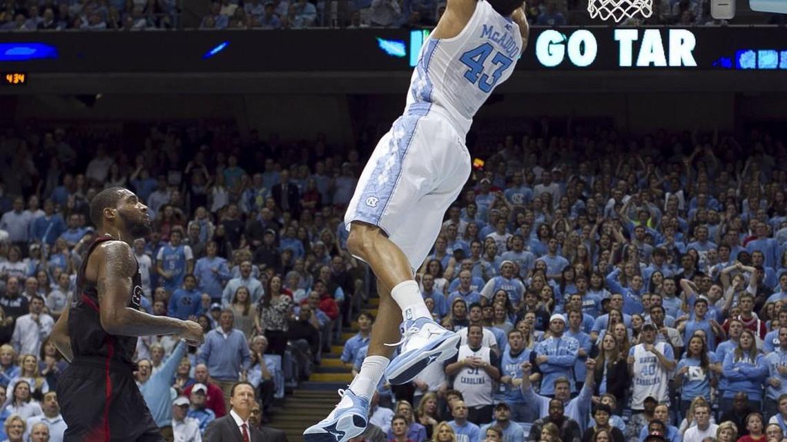 UNC's James Michael McAdoo (43) does a reverse dunk during a 2013 game with N.C. State. Now with the NBA’s Golden State Warriors.
