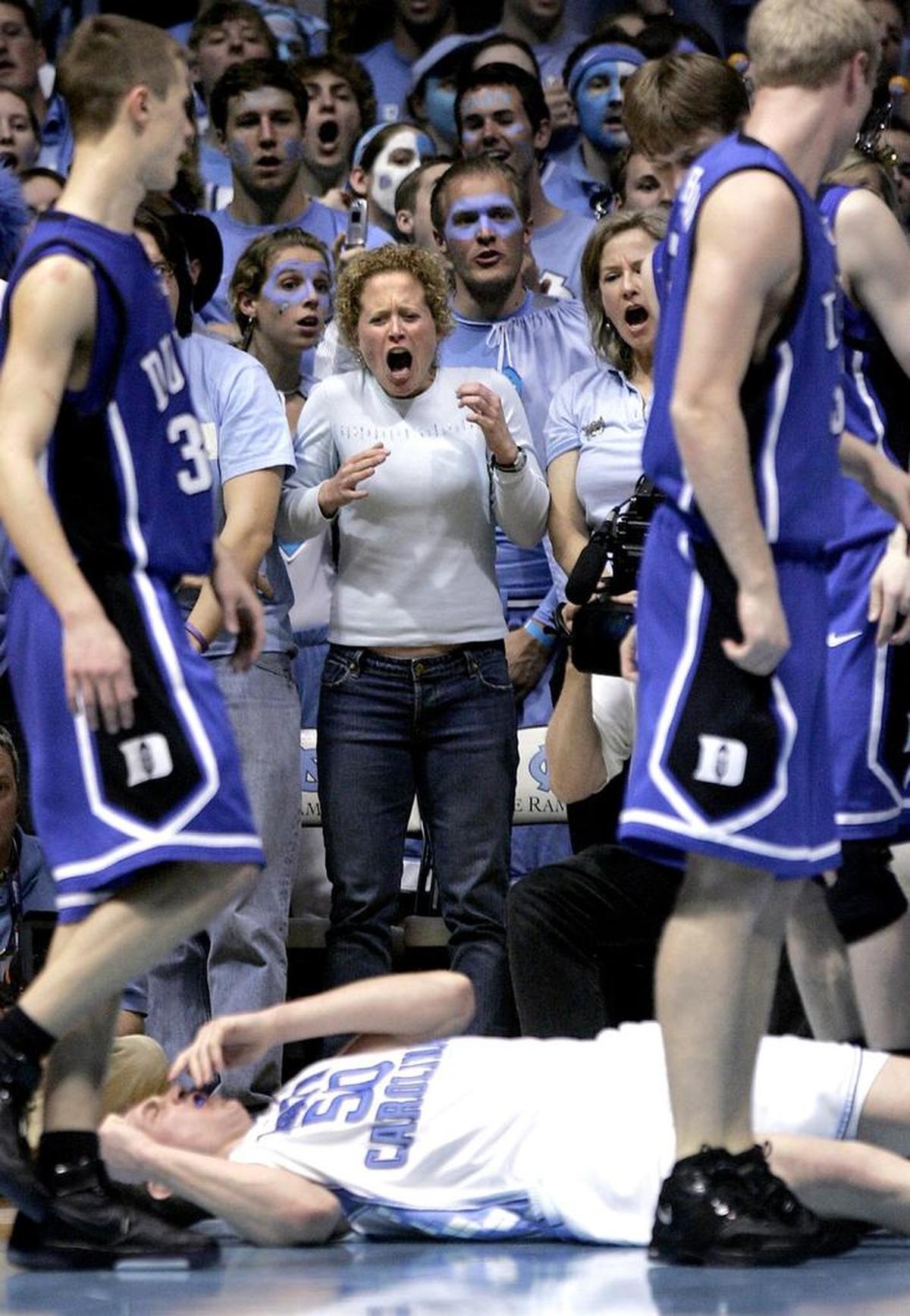 UNCDUKE2.SP.030407.EDR.JPG UNC fans react after a flagrant foul by Duke's Gerald Henderson (not pictured) knocked down UNC's Tyler Hansbrough late during the second half at the Smith Center on Sunday, March 4, 2007.Duke's Gerald Henderson was ejected from the game. UNC won 86-72. News & Observer staff photo by Ted Richardson.