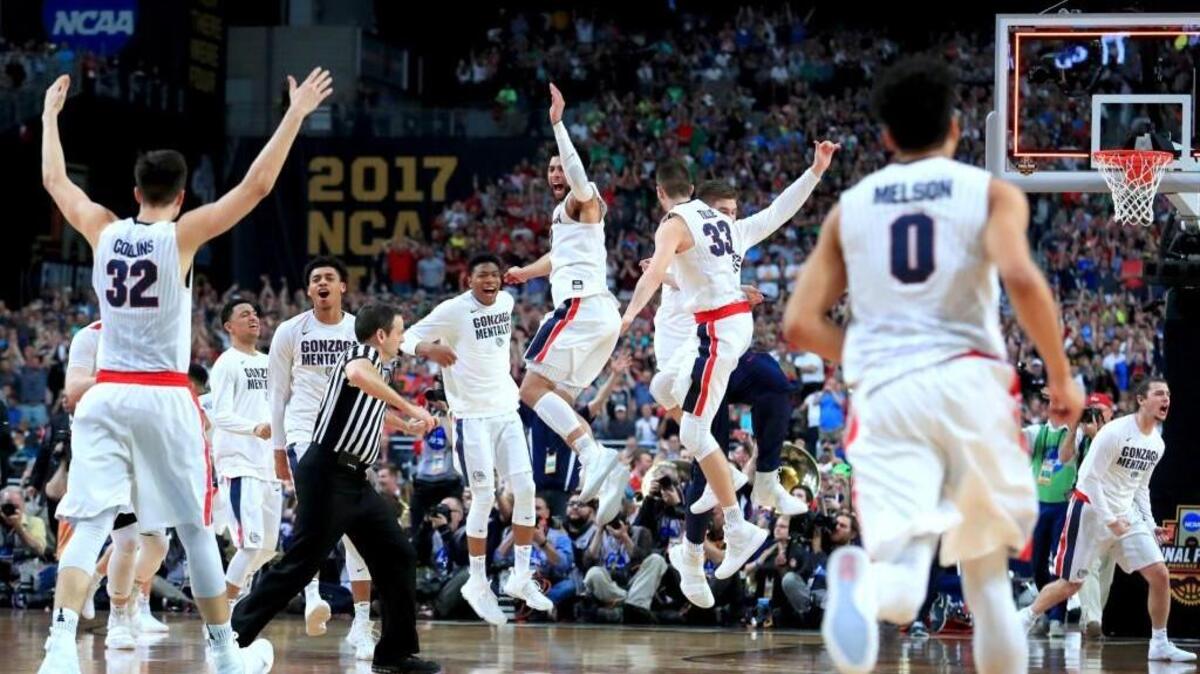 Gonzaga celebrates after defeating South Carolina 77-73 in the Final Four on Saturday. The Bulldogs will play UNC Monday in the national title game.