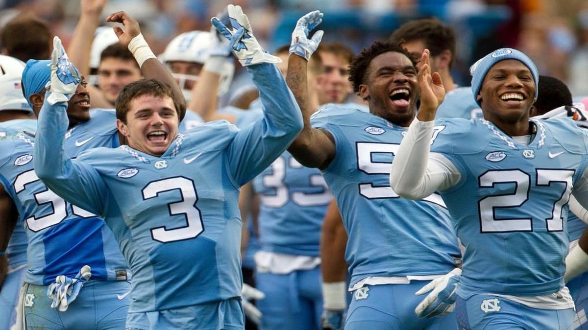 With a comfortable 59-24 lead over Duke, the Tar Heels, lead by Ryan Switzer (3), celebrate with the their fans as the fourth quarter begins at Kenan Stadium in Chapel Hill.