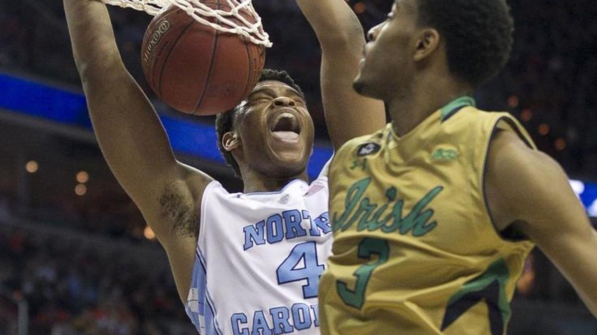 North Carolina's Isaiah Hicks (4) gets a dunk over Notre Dame's V.J. Beachem (3) during a semifinal of the ACC tournament in Washington on March 11. UNC advanced, 78-47.