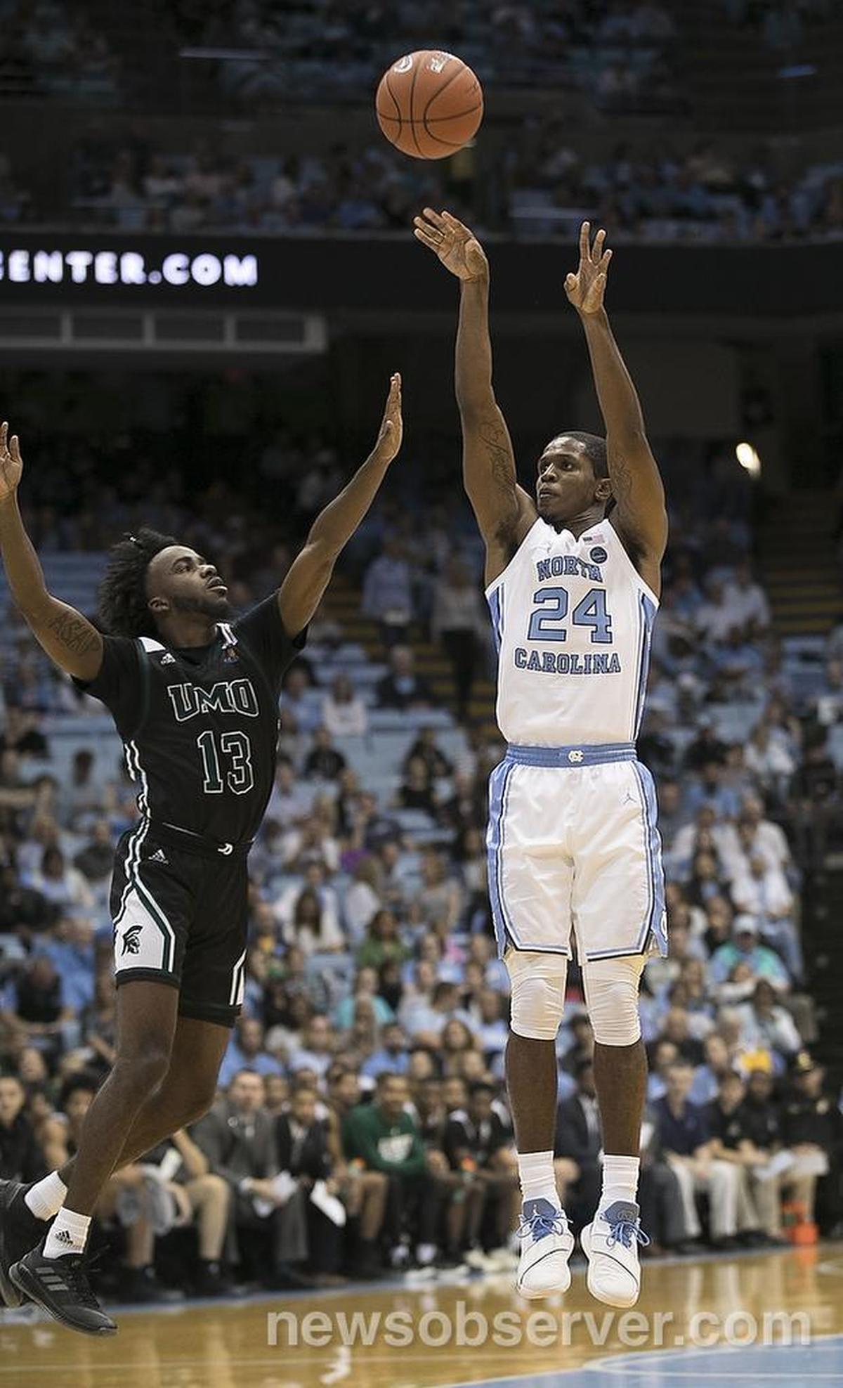 North Carolina’s Kenny Williams (24) shoots over Mt. Olive’s Darius Spragley (13) during the second half on Friday, November 2, 2018 at the Smith Center in Chapel Hill, N.C.