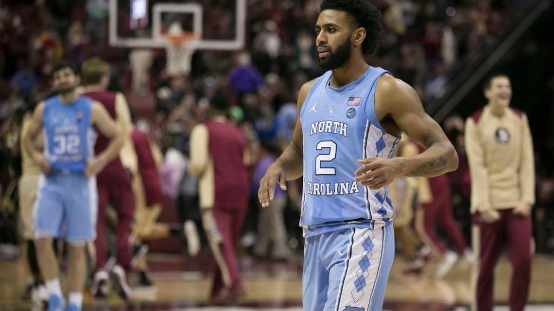 North Carolina’s Joel Berry II (2) and Luke Maye (32) react as time expires and Florida State begins their celebration after defeating North Carolina 81-80 on Wednesday, January 3, 2018 at the Tucker Civic Center in Tallahassee, Fla.