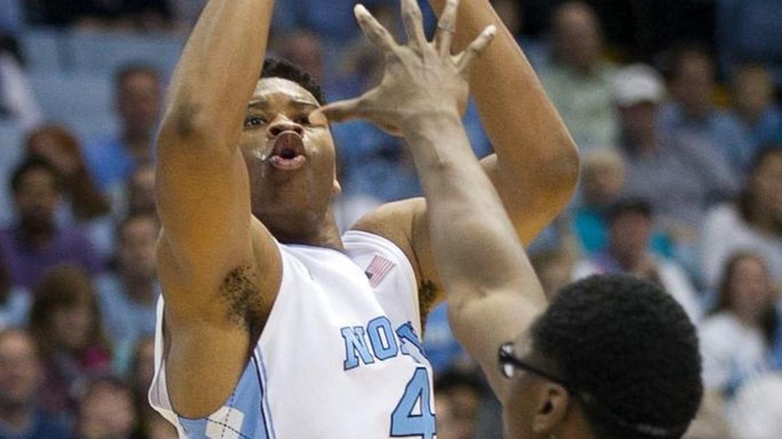 North Carolina’s Isaiah Hicks shoots over Tulane’s Blake Paul on Dec. 16. Hicks, who had six points in 90 seconds against the Green Waves, has been working to build his confidence and be more aggressive.