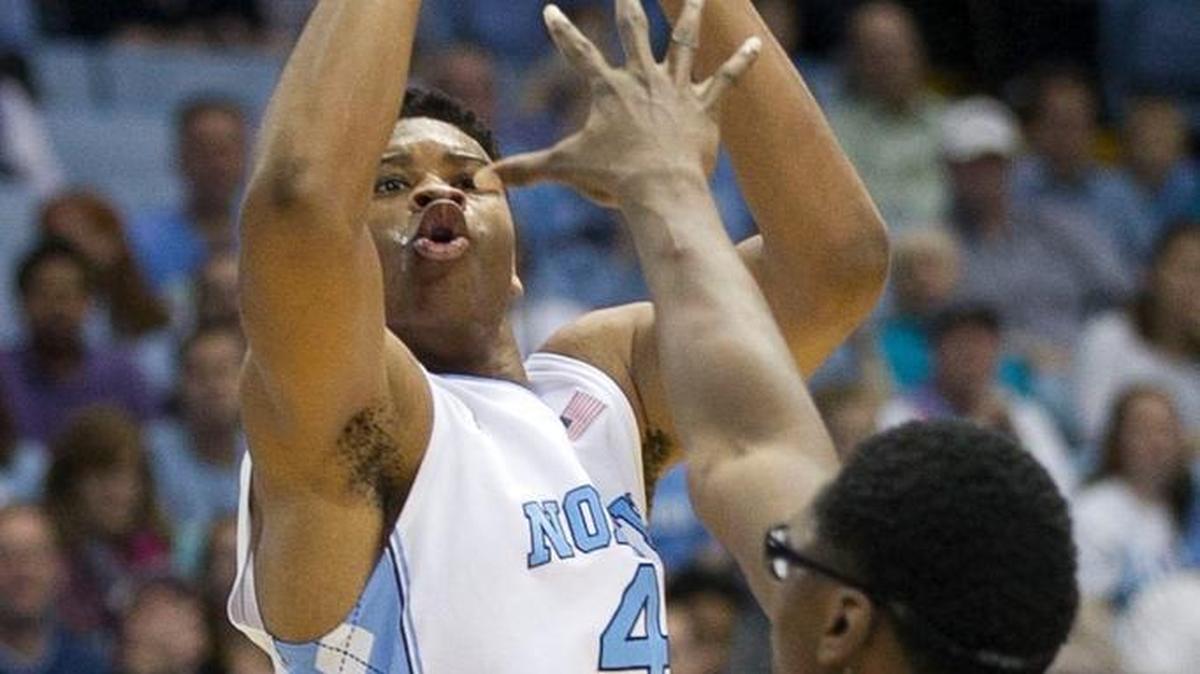 North Carolina’s Isaiah Hicks shoots over Tulane’s Blake Paul on Dec. 16. Hicks, who had six points in 90 seconds against the Green Waves, has been working to build his confidence and be more aggressive.