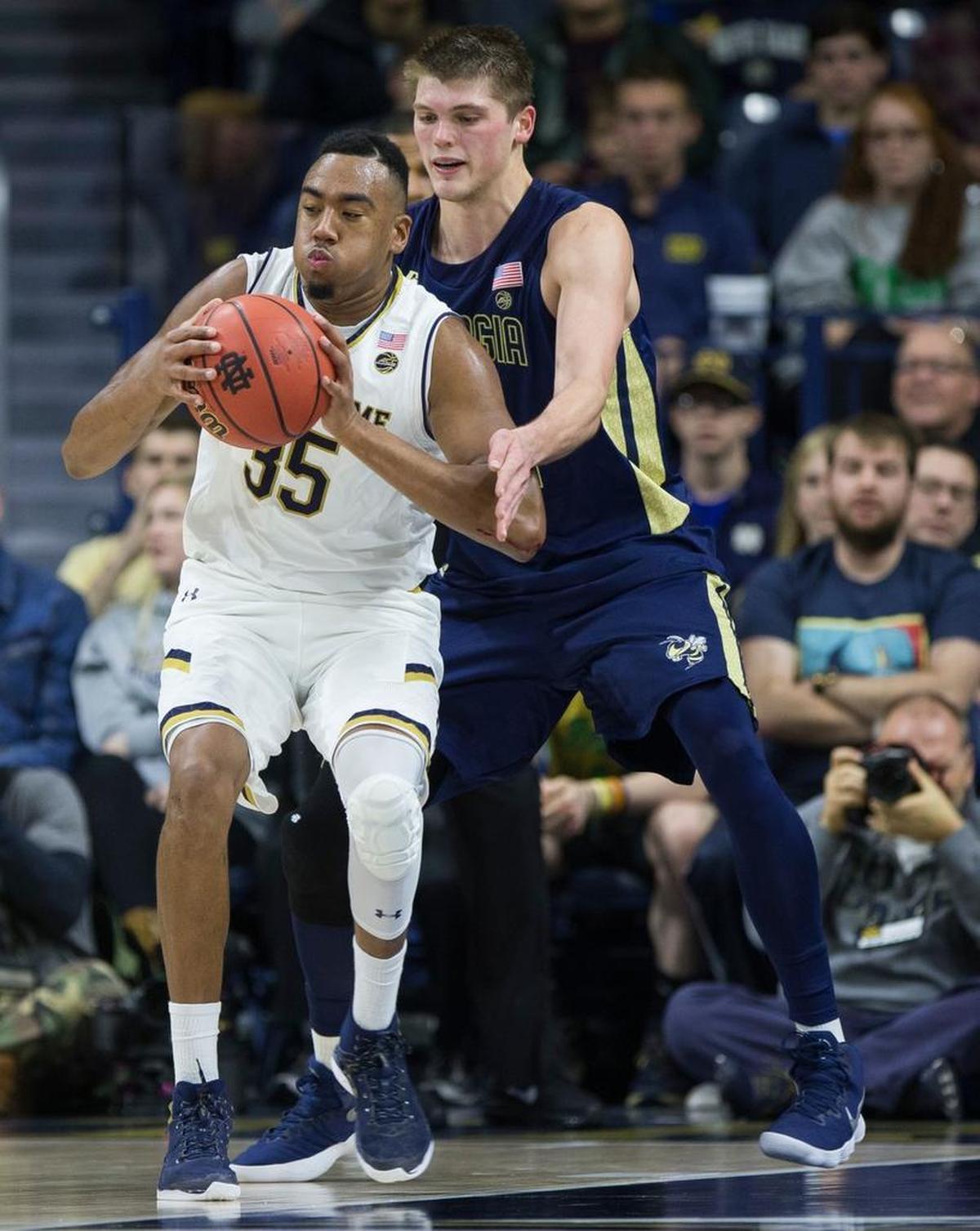 Notre Dame's Bonzie Colson (35) gets pressure from Georgia Tech's Ben Lammers on December 30, 2017, in South Bend, Ind. (AP Photo/Robert Franklin)
