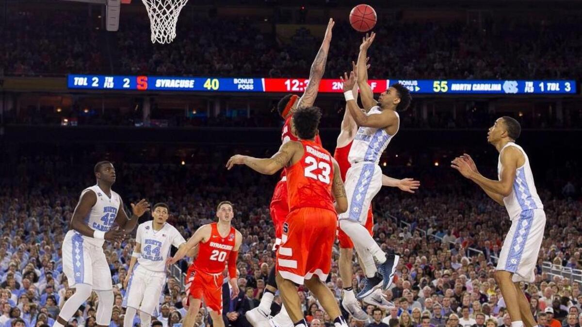 North Carolina’s Joel Berry II (2) puts up a shot over Syracuse’s DaJuan Coleman (32) in the second half of the NCAA Tournament semifinal game on Saturday April 2, 2016 at the NRG Stadium in Houston, Texas.