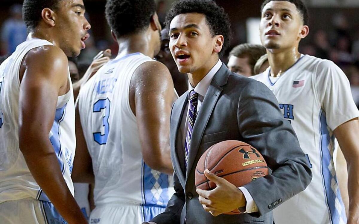 North Carolina’s Marcus Paige, out with a broken hand, huddles with teammates during the second half against Temple on Nov 13 at Alumni Hall in Annapolis, Md.