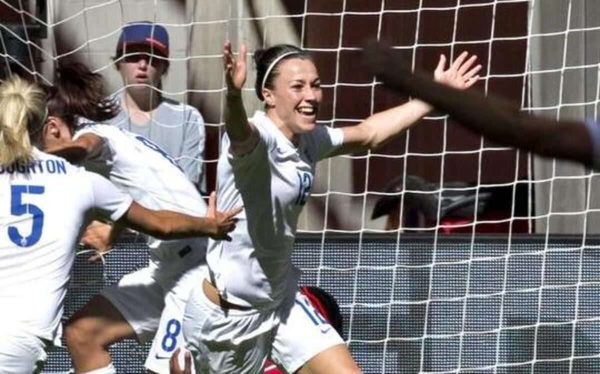
England defender Lucy Bronze (C) celebrates her goal against Canada with teammate Steph Houghton and Claire Rafferty (R) during a quarterfinal football match at the 2015 FIFA Women's World Cup at BC Place Stadium in Vancouver on June 27, 2015. 
