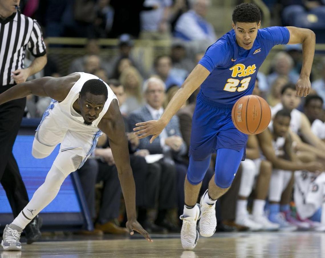 UNC’s Theo Pinson, left, and Pittsburgh’s Cameron Johnson chase down a loose ball in February.