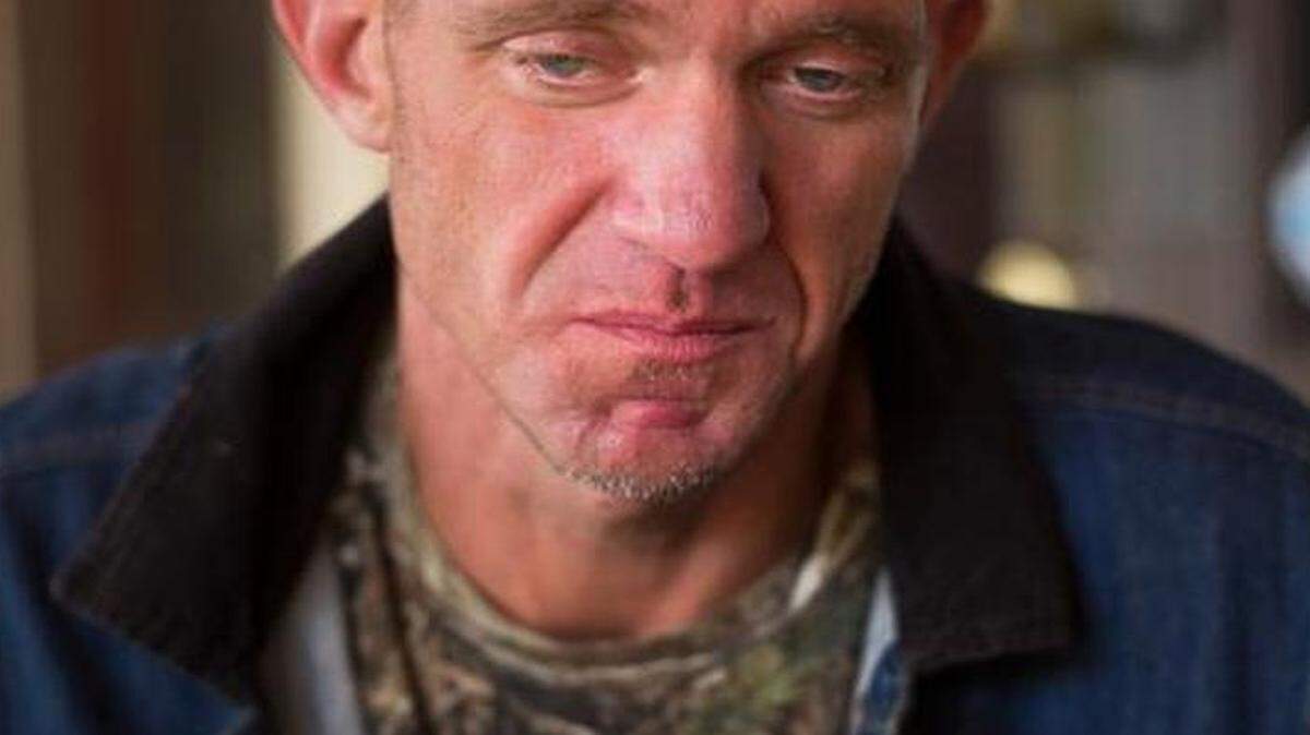 Ryan Hoffman tears up while talking about his daughter at Harry's, a restaurant in Lakeland, Fla., Jan. 7, 2015. Hoffman, once a 287-pound starting left tackle for a top-ten ranked University of North Carolina football team, renowned for his toughness and durability, is now plagued with short-term memory problems and lives on the street, sometimes begging money from passing cars.