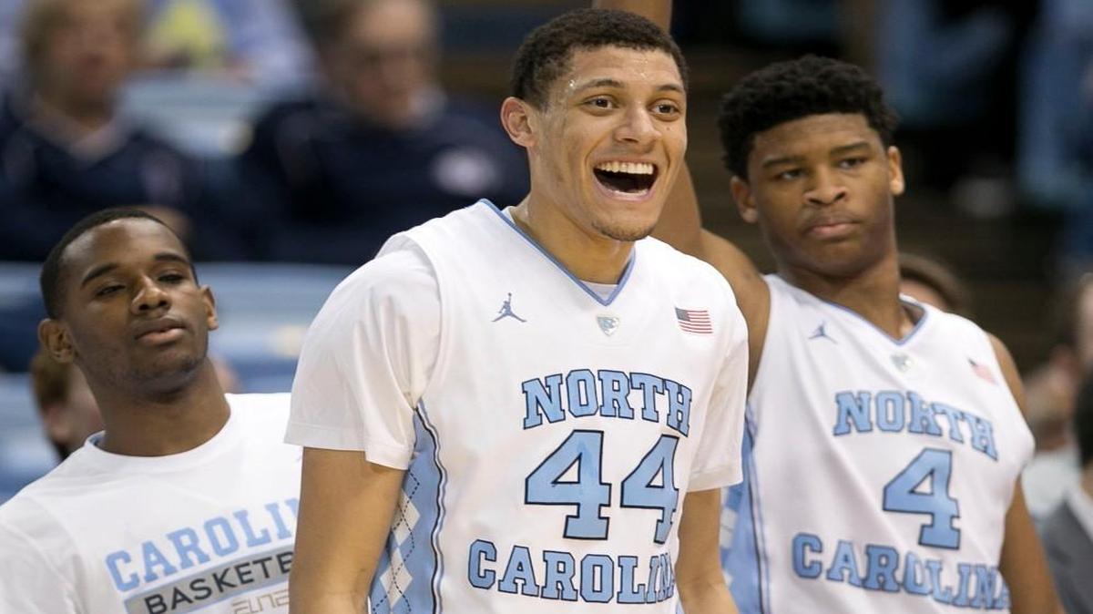North Carolina’s Justin Jackson (44) reacts to a three point basket by teammate Luke Maye (32) to seal the Tar Heelss 85-64 victory over Pitt on Sunday.