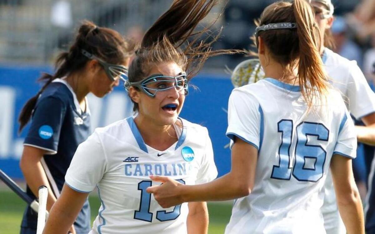 North Carolina's Carly Reed, right, celebrates her first half goal with Sammy Jo Tracy, left, which gave UNC a 6-5 lead over Penn State in the NCAA Women's Lacrosse Semi-Final on on May 27, 2016 at Talen Energy Stadium in Chester, PA.