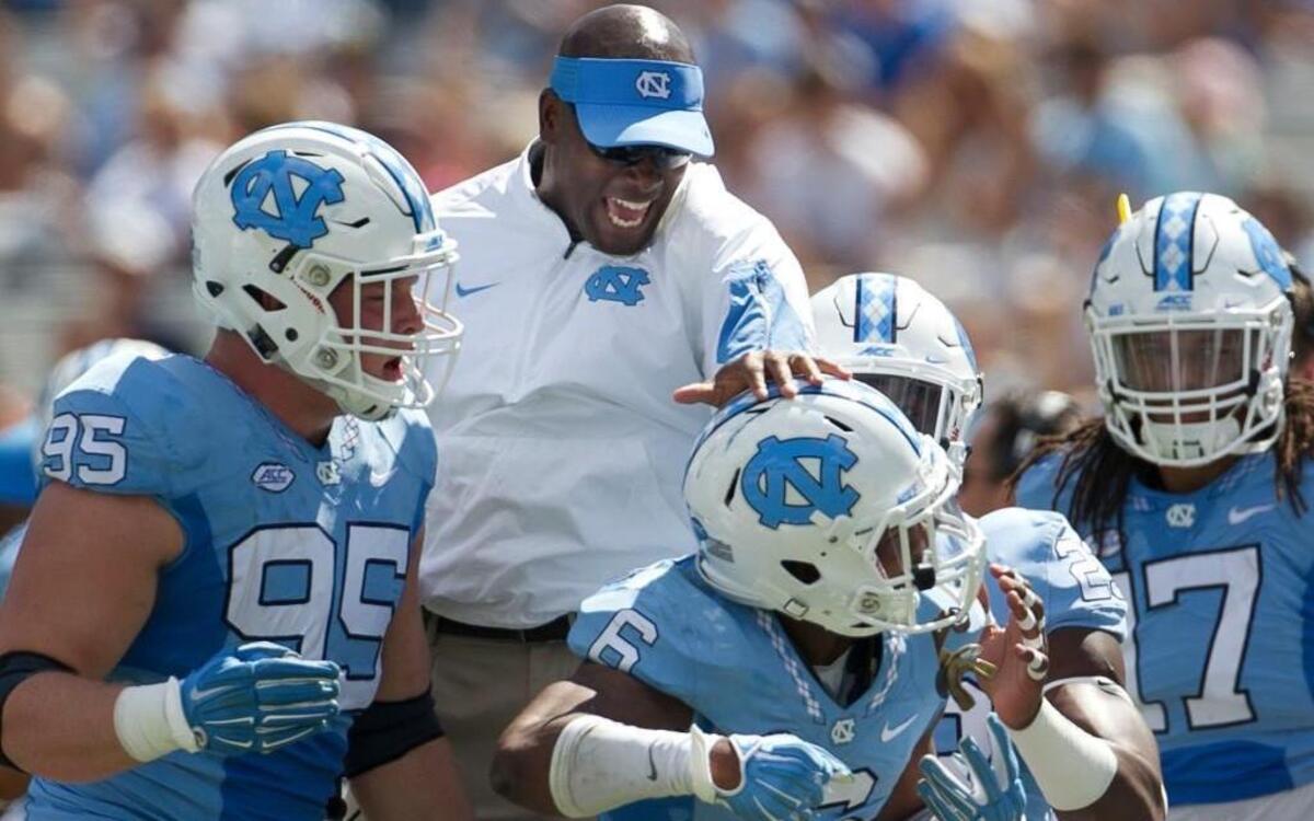 North Carolina defensive backs coach Carlton Warren congratulates M.J. Stewart (6) after is interception of Illinois quarterback Wes Lunt in the first quarter on Saturday, September 19, 2015 at Kenan Stadium in Chapel Hill, N.C.