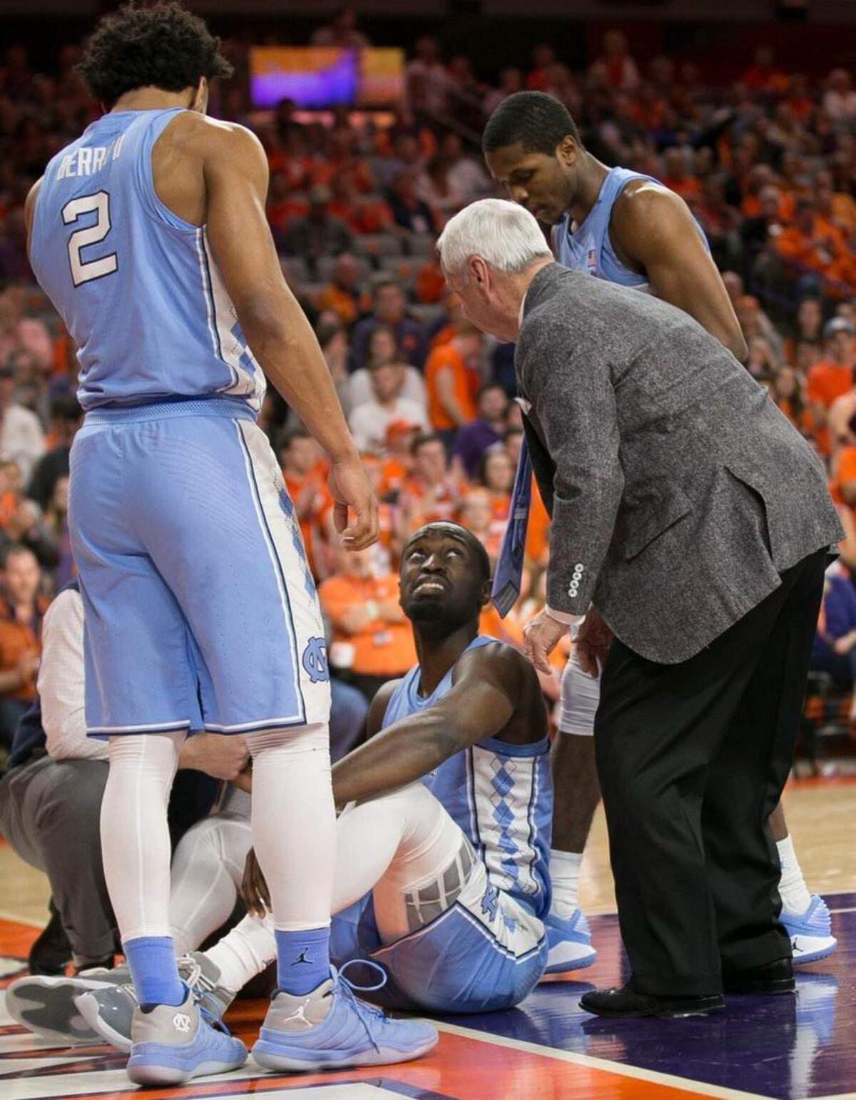 North Carolinas Theo Pinson (1) talks with coach Roy Williams after falling early in the first half against Clemson on Tuesday, January 30, 2018 at Littlejohn Coliseum in Clemson, S.C. Pinson injured his hip and shoulder on the fall and did not return to play.
