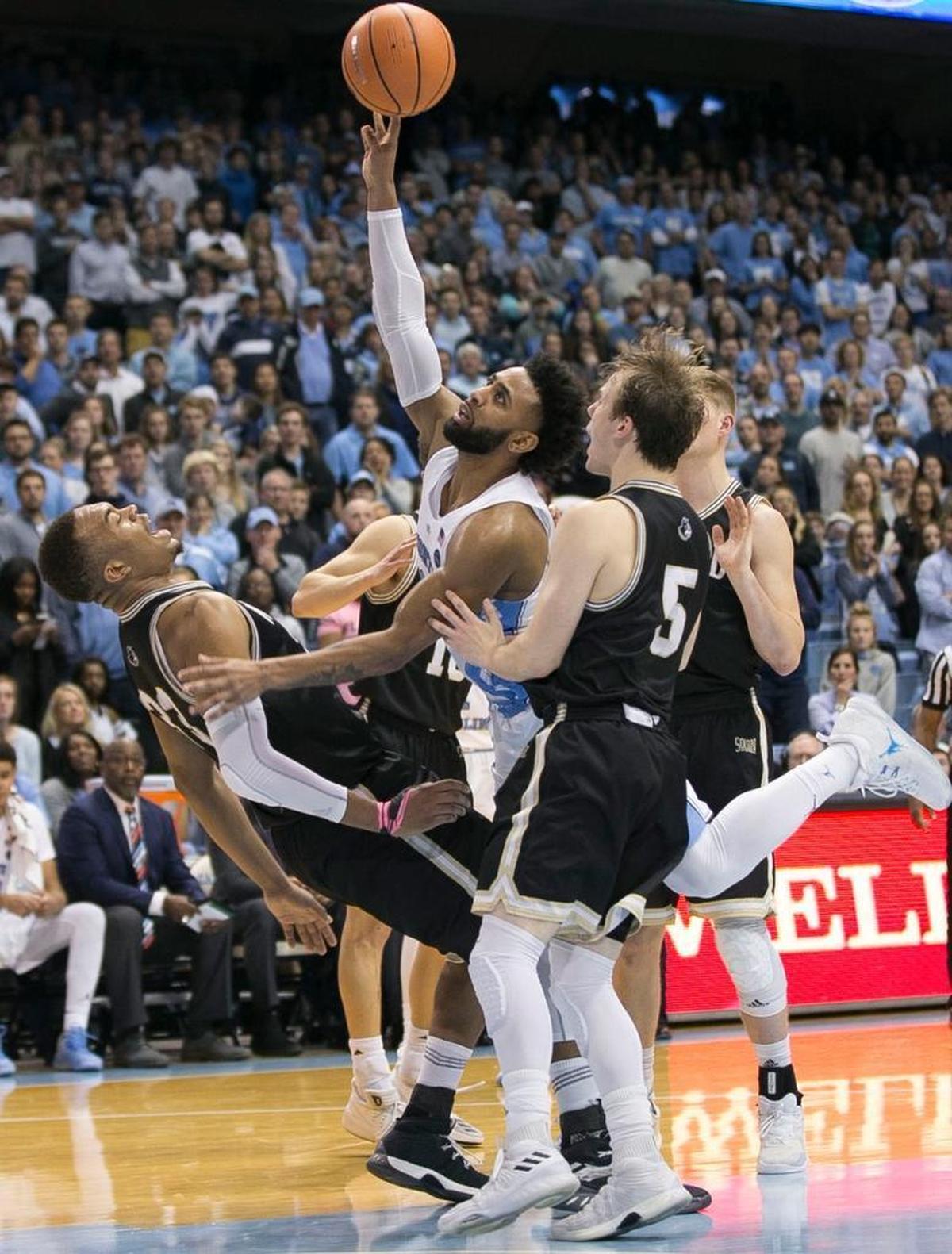 North Carolina’s Joel Berry II (2) drives to the basket against Wofford’s Cameron Jackson (33) during the second half on Wednesday, December 20, 2017 at the Smith Center in Chapel Hill, N.C.