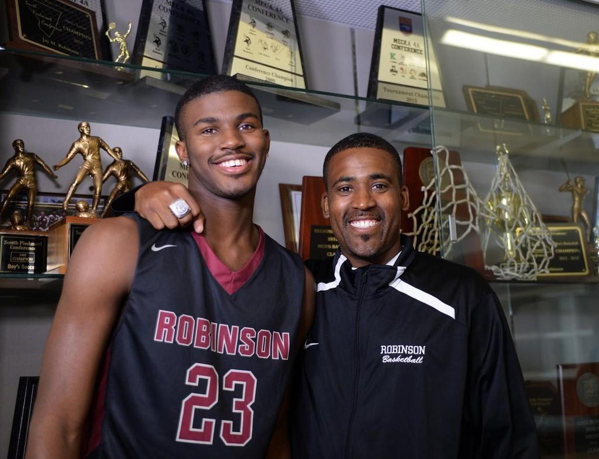 Concord Robinson's Lavar Batts Jr., left, with his father Lavar Batts Sr., has signed with N.C. State -- Diedra Laird Charlotte Observer file photo