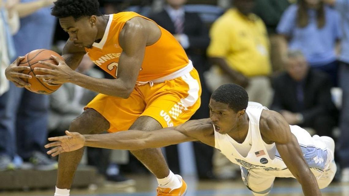North Carolina’s Kenny Williams goes after a steal from Tennessee’s Jordan Bowden during the first half at the Smith Center.
