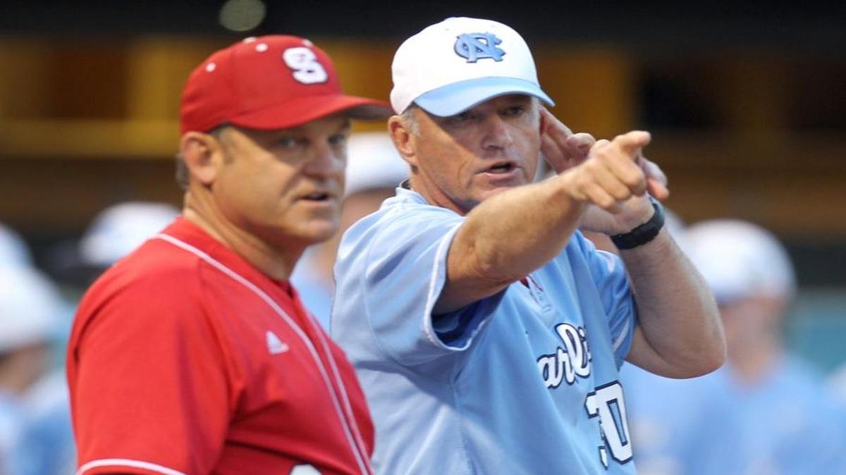 North Carolina head coach Mike Fox talks with N.C. State head coach Elliott Avent before their game Friday, April 10, 2015 at Boshamer Stadium in Chapel Hill.