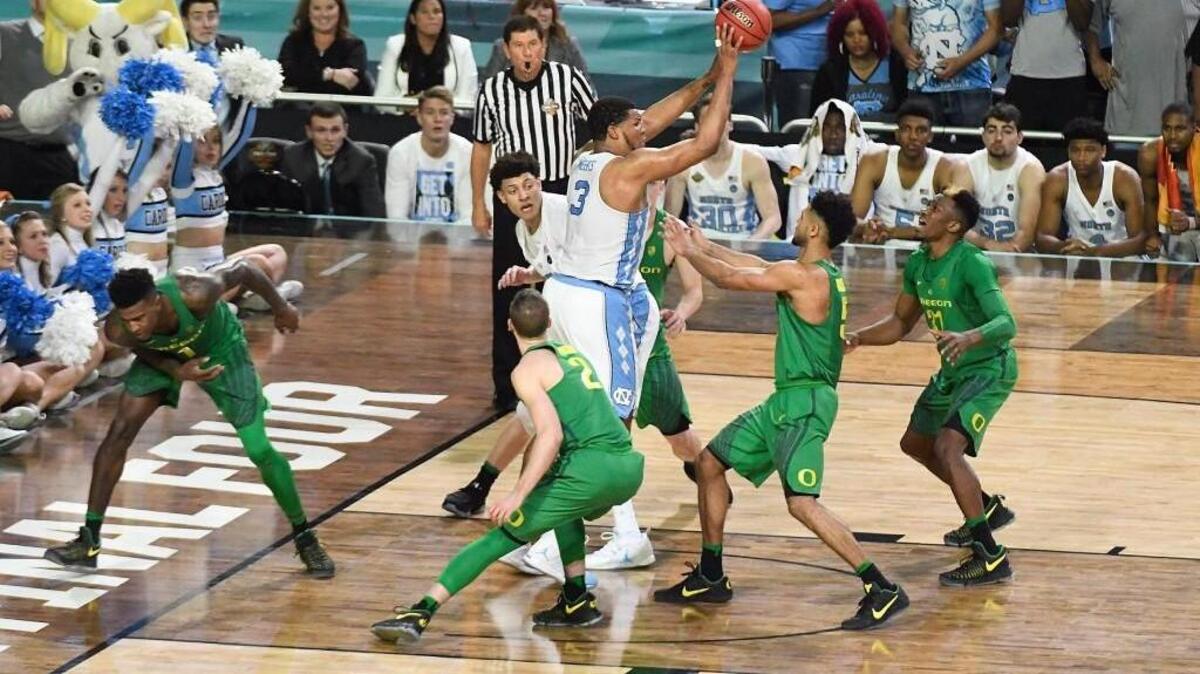 UNC forward Kennedy Meeks (3) grabs a rebound to seal the Tar Heels’ 77-76 win over Oregon in the Final Four on Saturday.