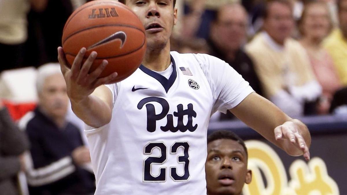 In this Saturday, Feb. 11, 2017, file photo, Pittsburgh's Cameron Johnson (23) shoots after getting by Syracuse's Frank Howard during the first half of an NCAA college basketball game in Pittsburgh. Johnson has committed to play at North Carolina as a graduate transfer, but is seeking to be eligible to play immediately. Pittsburgh has said Johnson should sit out one year.