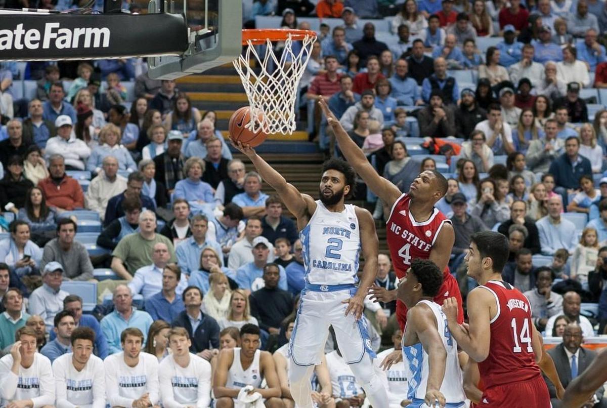 North Carolina’s Joel Berry II, left, drives to the basket against N.C. State’s Dennis Smith Jr. in UNC’s 107-56 win over the Wolfpack on Jan. 8, 2017.