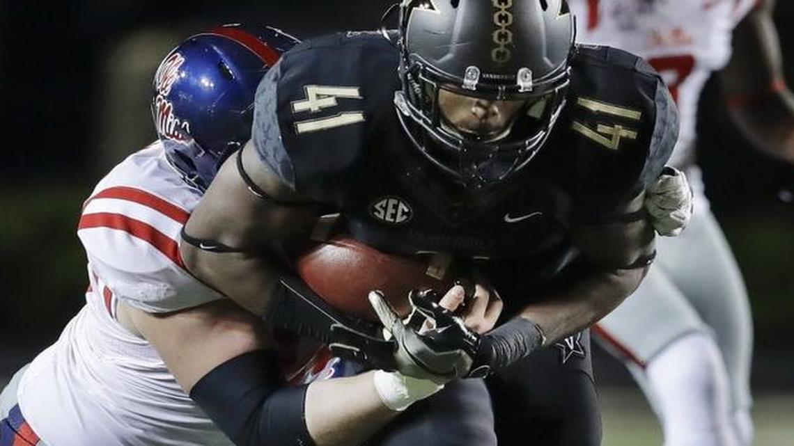 Vanderbilt linebacker Zach Cunningham (41) recovers a fumble against Mississippi during the second half of Nov. 19 in Nashville, Tenn.