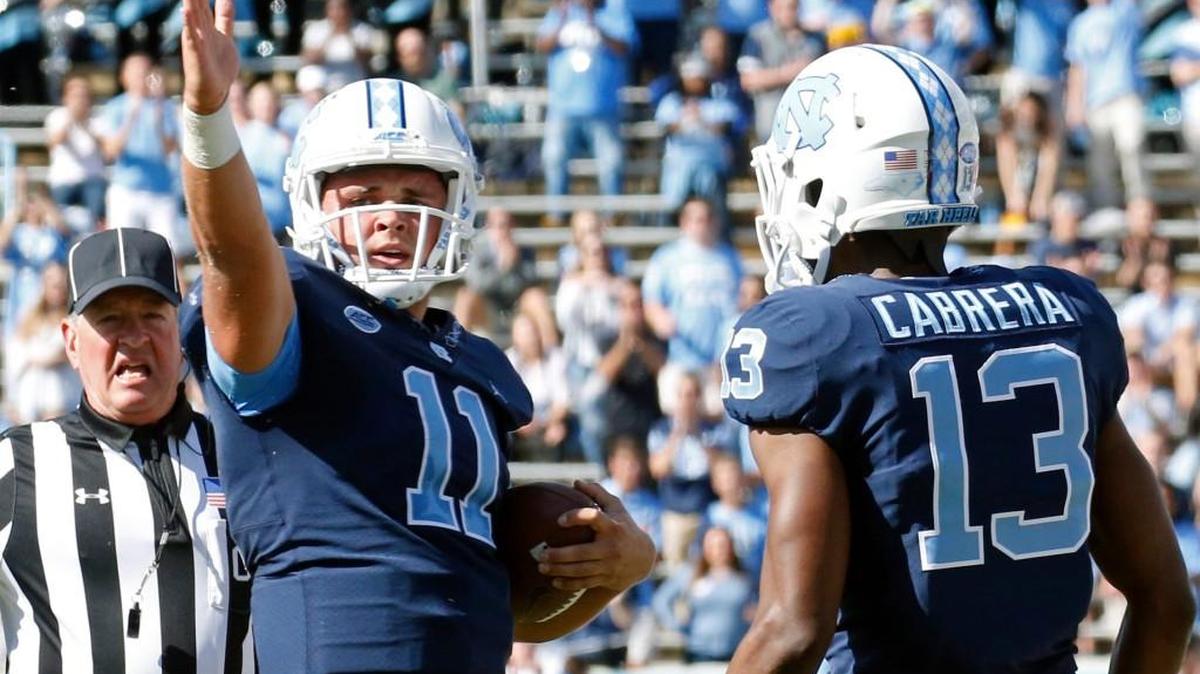 UNC's Nathan Elliott (11) signals first down against Miami.