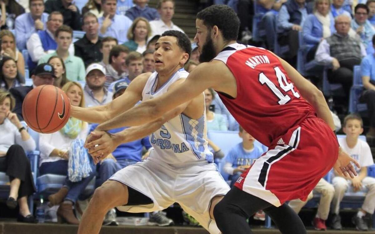 N.C. State’s Caleb Martin forces UNC’s Marcus Paige to turn the ball over during the first half of their game Saturday at the Smith Center.