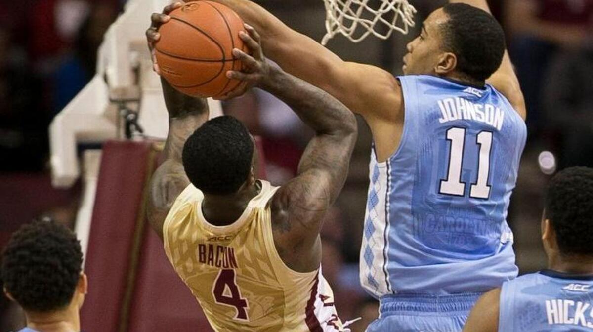 North Carolina’s Brice Johnson (11) blocks a shot by Florida State’s Dwayne Bacon Jr. (4) in the Tar Heels’ 106-90 victory over Florida State on Jan. 4 at the Tucker Center in Tallahassee, Fla.