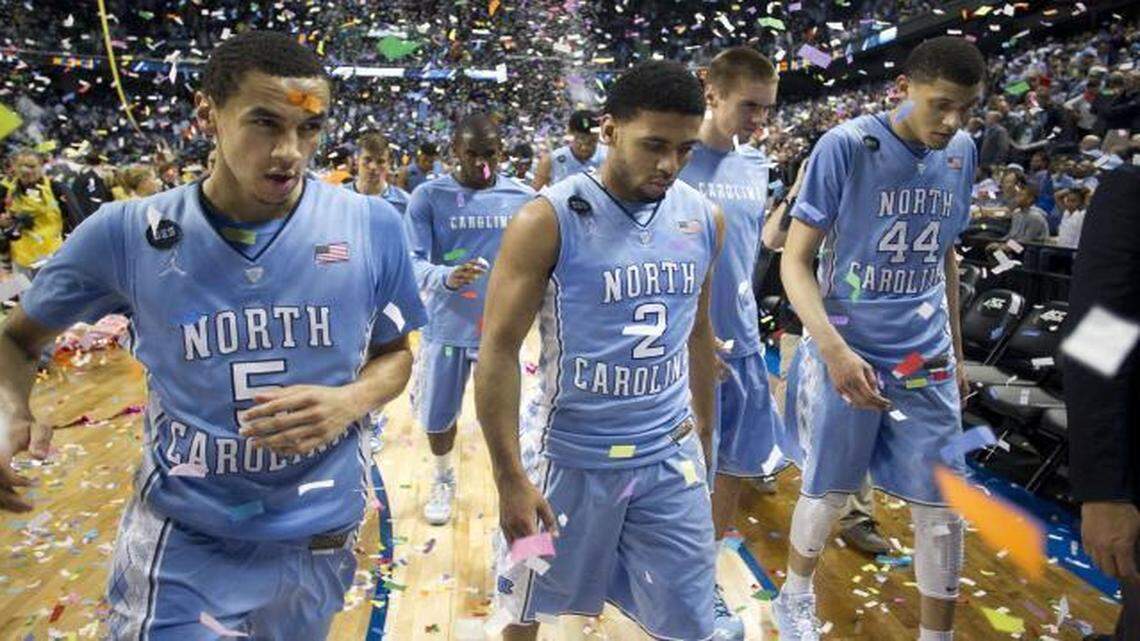 
North Carolina’s Marcus Paige (5) and his teammates leaves the court following the Tar Heels’ 90-82 loss to Notre Dame in the championship game of the Atlantic Coast Conference Basketball Tournament at the Greensboro Coliseum.
