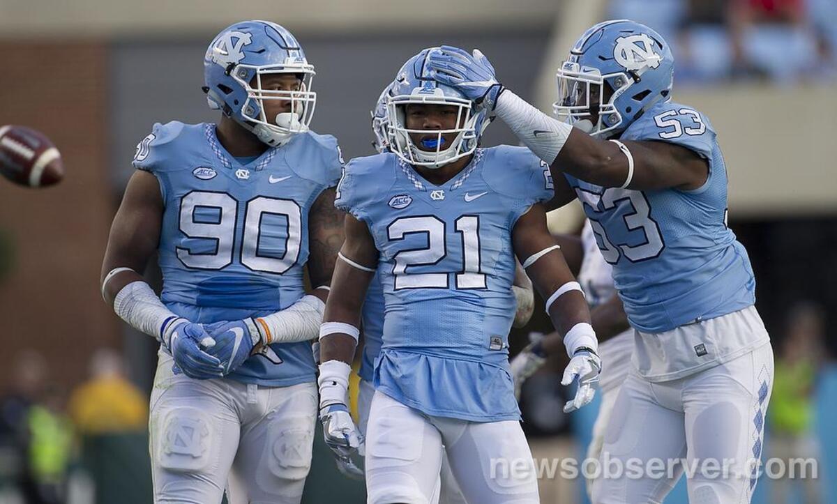 North Carolina’s Malik Carney (53) congratulates Myles Dorn (21) after a defensive stop in the second quarter.