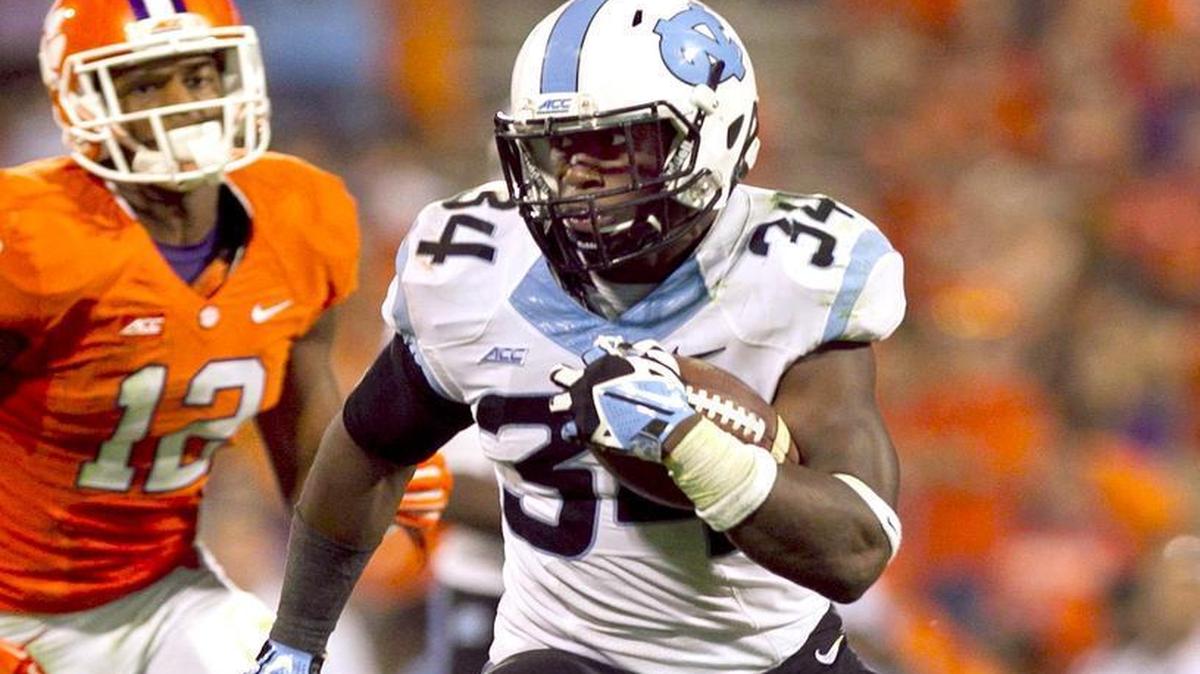 
UNC's Elijah Hood (34) breaks into the Clemson secondary for a gain of 19-yards during their game Saturday, September 27, 2014 at Memorial Stadium in Clemson, S.C. 
