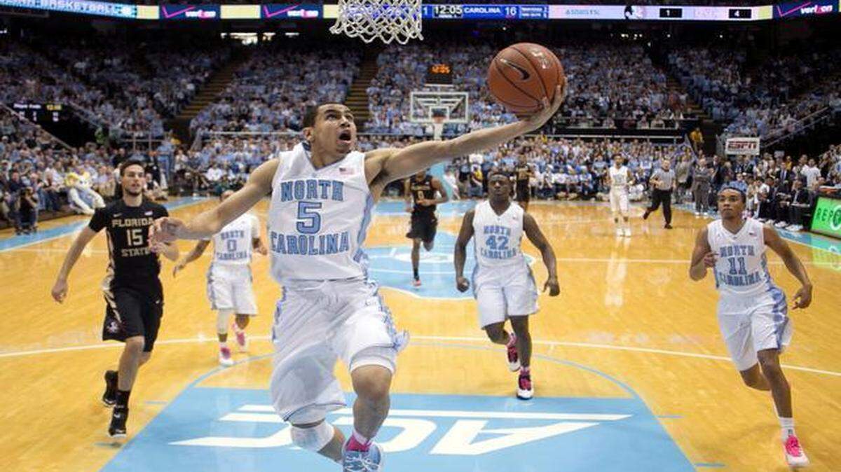 
Marcus Paige leads a fast break against Florida State on Jan. 24. He scored 19 points in the Tar Heels’ 78-74 victory, but he labored through some games as he suffered through plantar fasciitis. 
