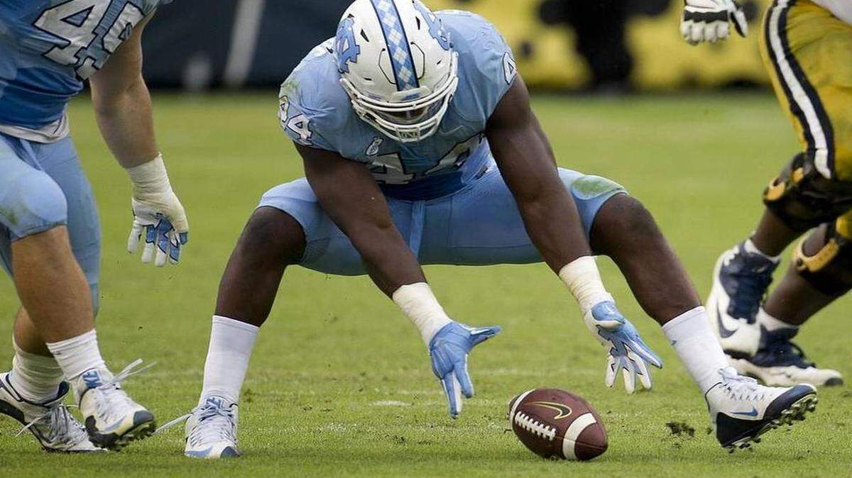 North Carolina’s Junior Gnonkonde (44) picks up a fumble by Georgia Tech quarterback Justin Thomas in the fourth quarter on Saturday.