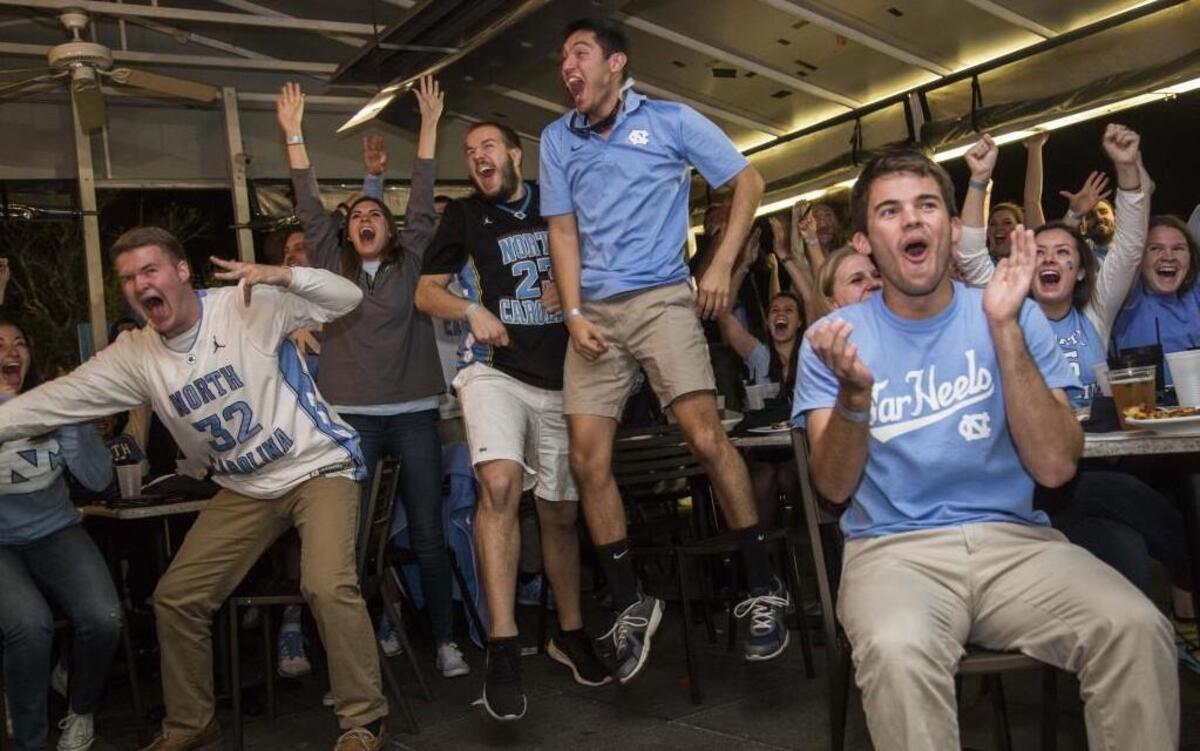 Fans at Top of the Hill Restaurant and Brewery on Franklin Street in Chapel Hill cheer on the Tar Heels as they take on Villanova during the NCAA mens basketball championship.