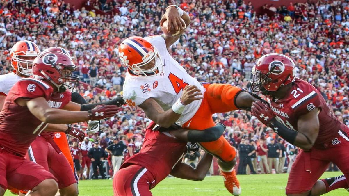 Clemson quarterback Deshaun Watson (4) scores one of his three touchdowns during the USC-Clemson game Saturday at Williams-Brice Stadium on November 28, 2015.