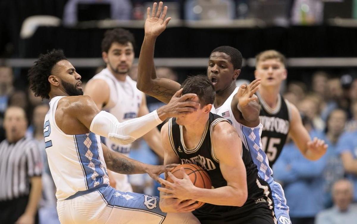 Wofford’s Fletcher Magee (3) is trapped in a 2017 game in Chapel Hill. Wofford upset the Tar Heels that day, however, and the Terriers are undefeated in the Southern Conference this season and a likely NCAA tournament team.